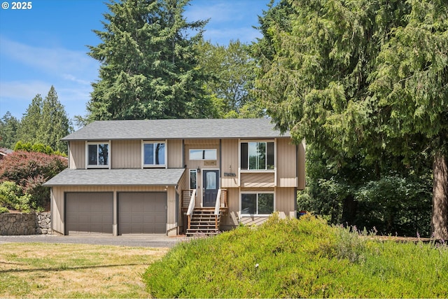 1625 SE Regner Rd, Gresham, OR 97080 - bi-level home featuring a shingled roof, an attached garage, driveway, and a front lawn