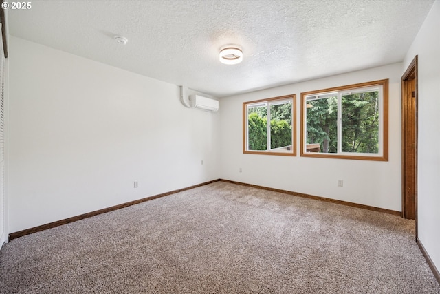 1625 SE Regner Rd, Gresham, OR 97080 - carpeted empty room with a wall unit AC, a textured ceiling, and a smoke detector