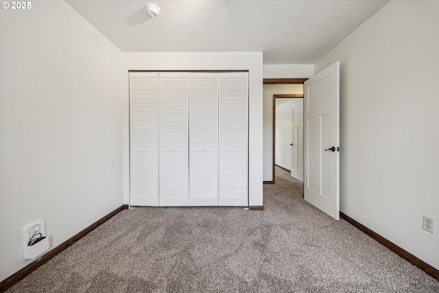 1625 SE Regner Rd, Gresham, OR 97080 - unfurnished bedroom with carpet flooring, a closet, and a textured ceiling