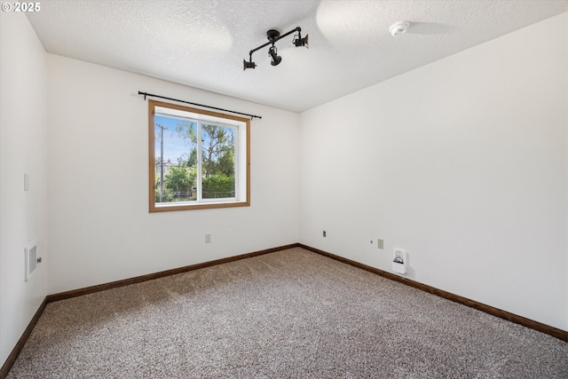 1625 SE Regner Rd, Gresham, OR 97080 - carpeted spare room with a textured ceiling and a smoke detector