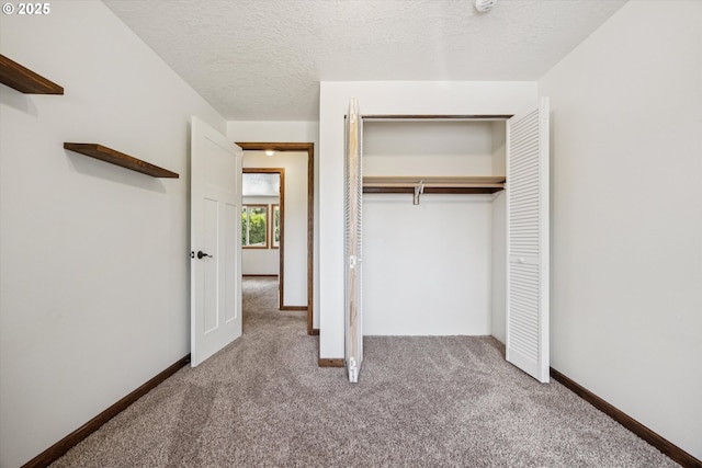1625 SE Regner Rd, Gresham, OR 97080 - unfurnished bedroom with carpet floors, a closet, and a textured ceiling
