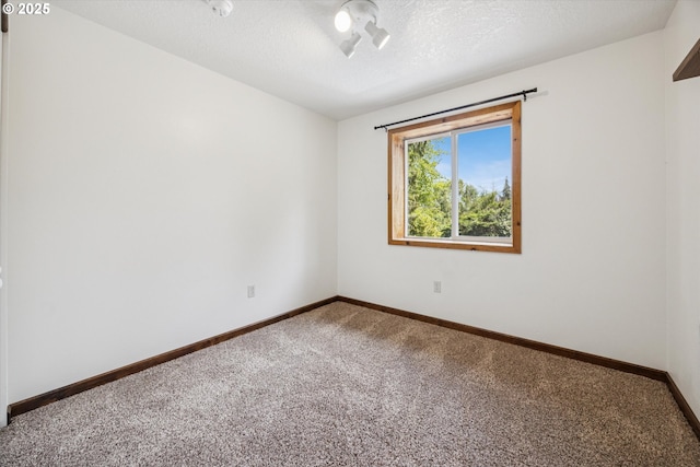 1625 SE Regner Rd, Gresham, OR 97080 - spare room featuring carpet floors and a textured ceiling