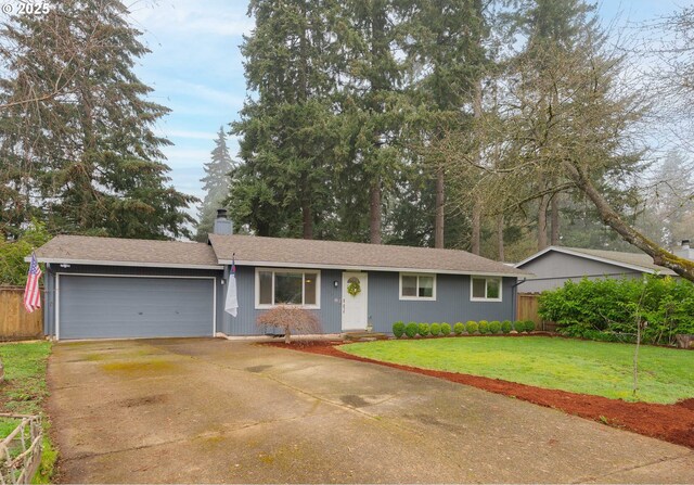 single story home featuring fence, an attached garage, a chimney, a front lawn, and driveway