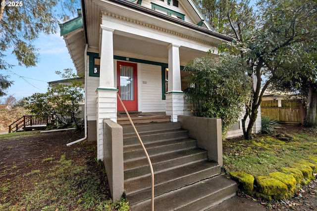 view of exterior entry featuring a porch