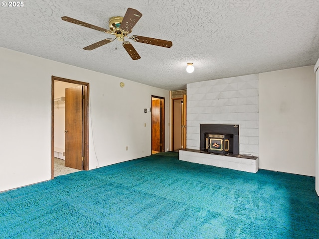 unfurnished living room with a textured ceiling, ceiling fan, and carpet floors