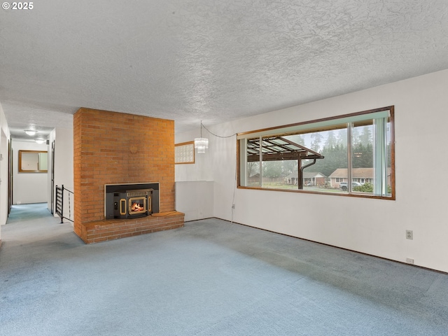 unfurnished living room featuring a textured ceiling and carpet