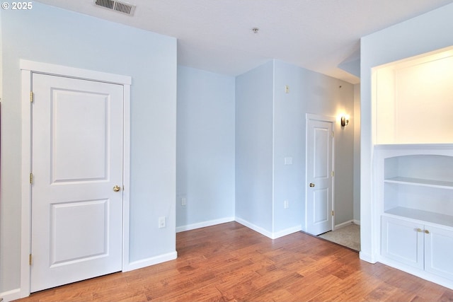 22860 SW Forest Creek Dr Unit 203, Sherwood, OR 97140 - empty room featuring wood finished floors and a pendent fire sprinkler