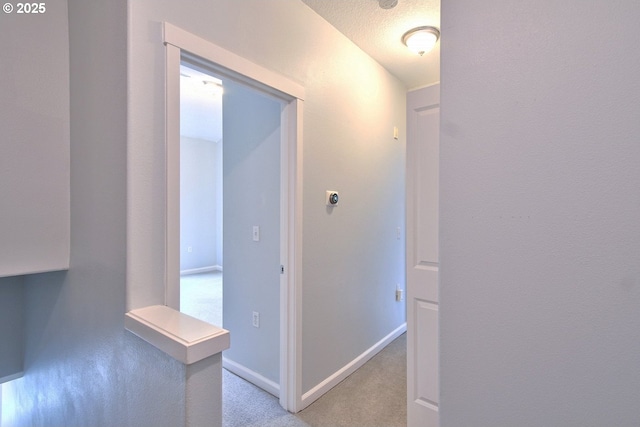 22860 SW Forest Creek Dr Unit 203, Sherwood, OR 97140 - hall featuring baseboards and light colored carpet
