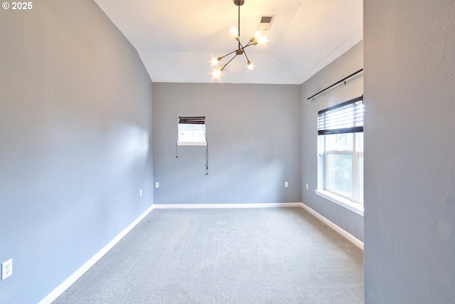 22860 SW Forest Creek Dr Unit 203, Sherwood, OR 97140 - carpeted empty room with a chandelier, healthy amount of natural light, and vaulted ceiling