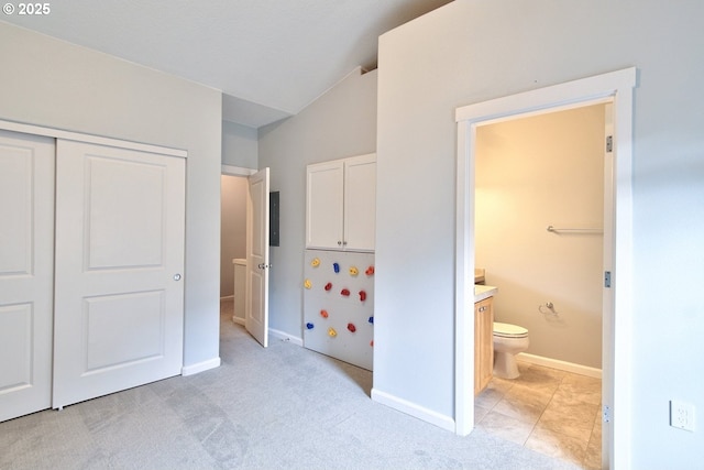 22860 SW Forest Creek Dr Unit 203, Sherwood, OR 97140 - unfurnished bedroom with a closet, ensuite bathroom, and light colored carpet