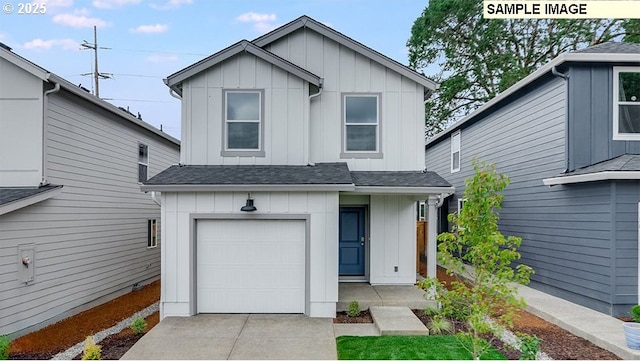 5416 NE 66th Pl, Vancouver, WA 98661 - view of front of house featuring board and batten siding, an attached garage, a shingled roof, and driveway
