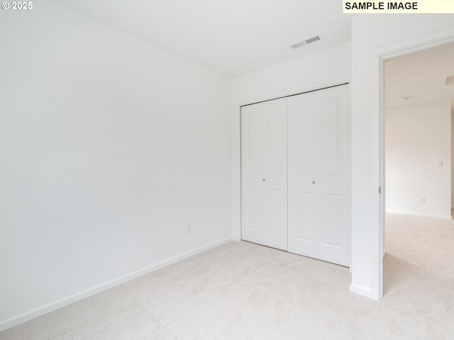 5416 NE 66th Pl, Vancouver, WA 98661 - unfurnished bedroom featuring light carpet, baseboards, and a closet
