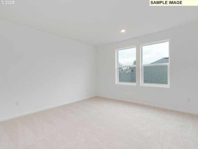 5416 NE 66th Pl, Vancouver, WA 98661 - empty room featuring light colored carpet, baseboards, and recessed lighting