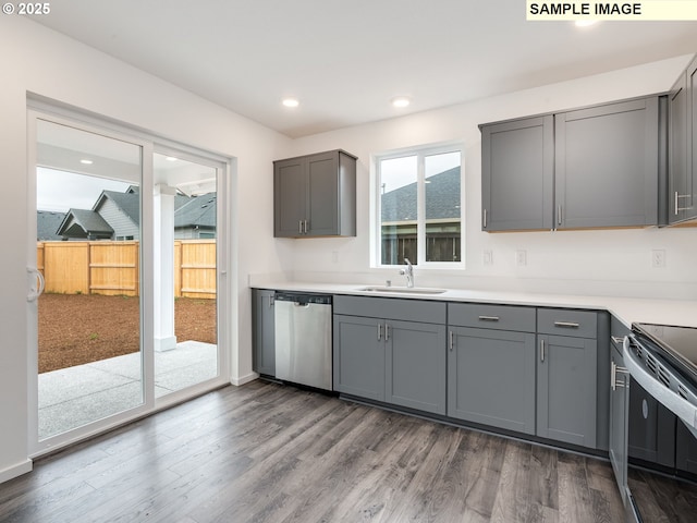 5416 NE 66th Pl, Vancouver, WA 98661 - kitchen with stainless steel dishwasher, gray cabinetry, electric range, dark wood-style flooring, and light countertops