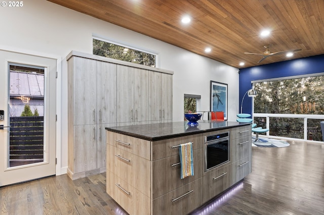 kitchen with a center island, wooden ceiling, modern cabinets, and dark wood-type flooring