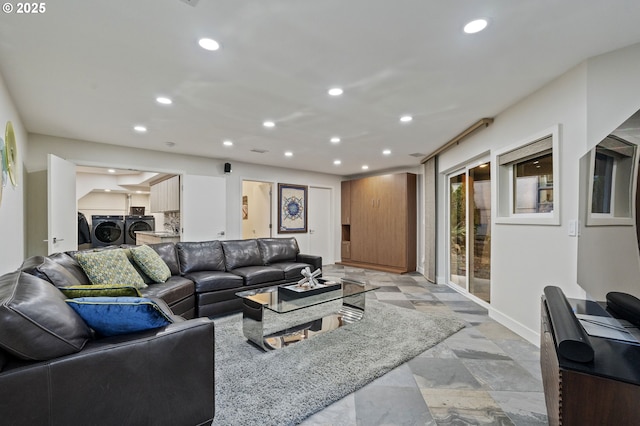 living room featuring washer and dryer, recessed lighting, and baseboards
