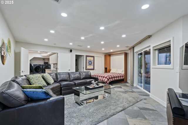 living room featuring washer and clothes dryer