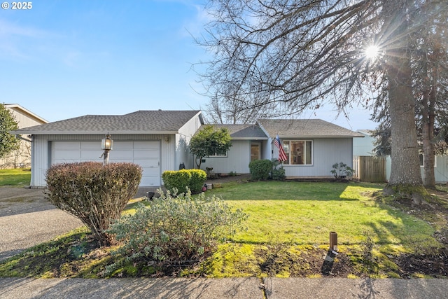 ranch-style house with a garage and a front yard