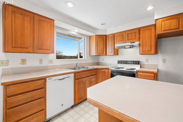 kitchen featuring sink and white appliances