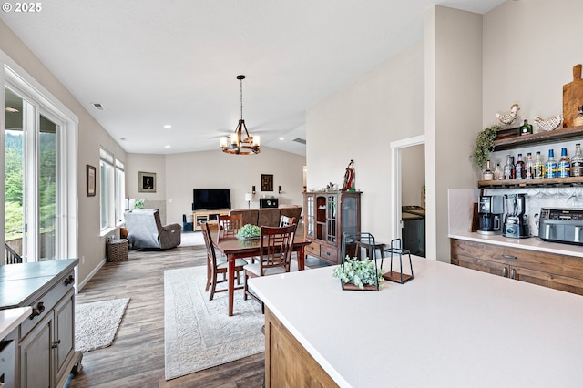 962 S 66th Pl, Springfield, OR 97478 - kitchen featuring dark wood-type flooring, a chandelier, light countertops, open floor plan, and hanging light fixtures