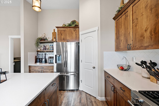 962 S 66th Pl, Springfield, OR 97478 - kitchen with stainless steel fridge, decorative backsplash, open shelves, and light countertops