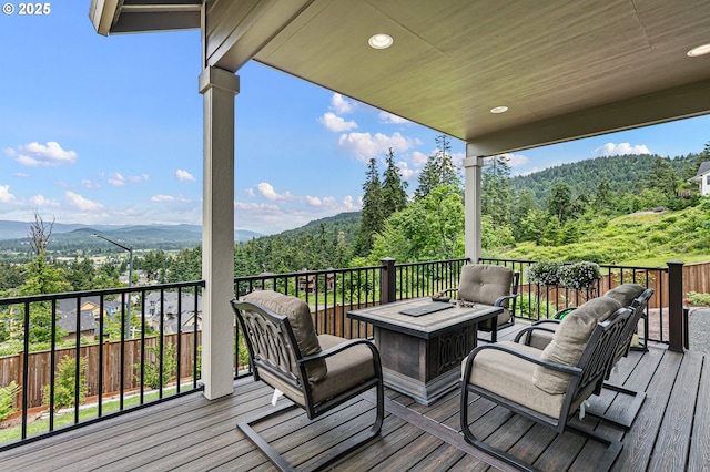 962 S 66th Pl, Springfield, OR 97478 - deck featuring a wooded view and an outdoor fire pit