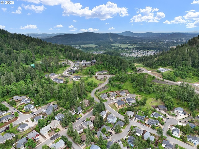 962 S 66th Pl, Springfield, OR 97478 - aerial view of property's location with mountains and a forest