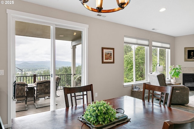 962 S 66th Pl, Springfield, OR 97478 - dining room with a chandelier, a mountain view, a high end fireplace, and recessed lighting