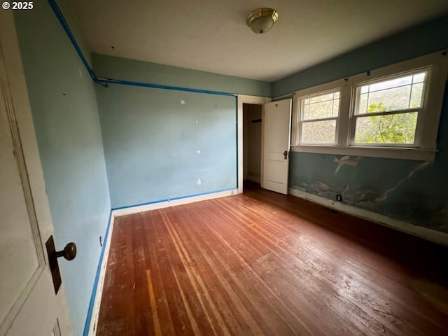 unfurnished bedroom featuring hardwood / wood-style floors