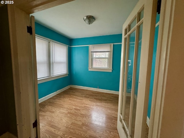 unfurnished room with light hardwood / wood-style flooring