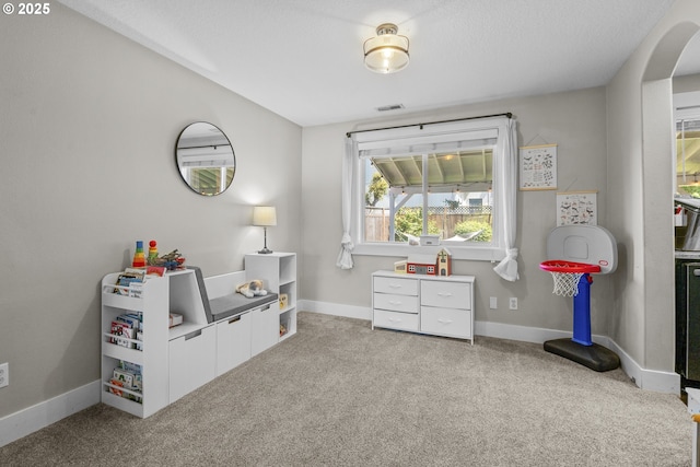 1366 Cramner St, Lafayette, OR 97127 - recreation room with arched walkways, carpet floors, and baseboards