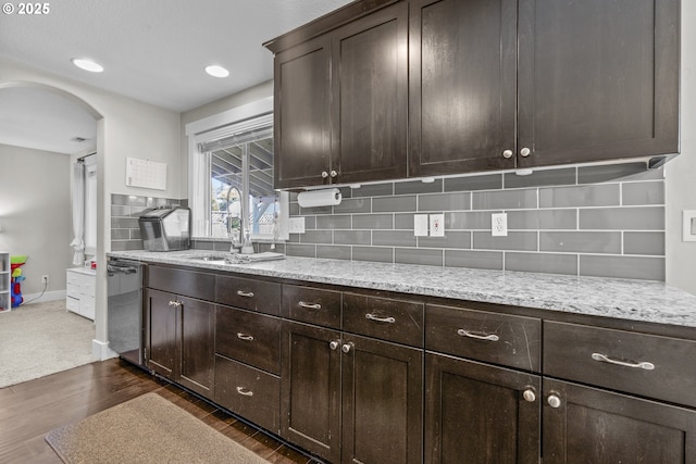 1366 Cramner St, Lafayette, OR 97127 - kitchen featuring arched walkways, dark brown cabinetry, dark wood-style flooring, and tasteful backsplash