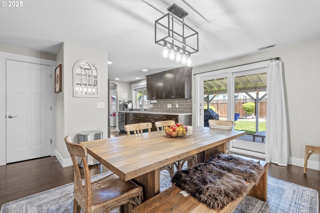 1366 Cramner St, Lafayette, OR 97127 - dining area with baseboards, dark wood-style floors, and recessed lighting