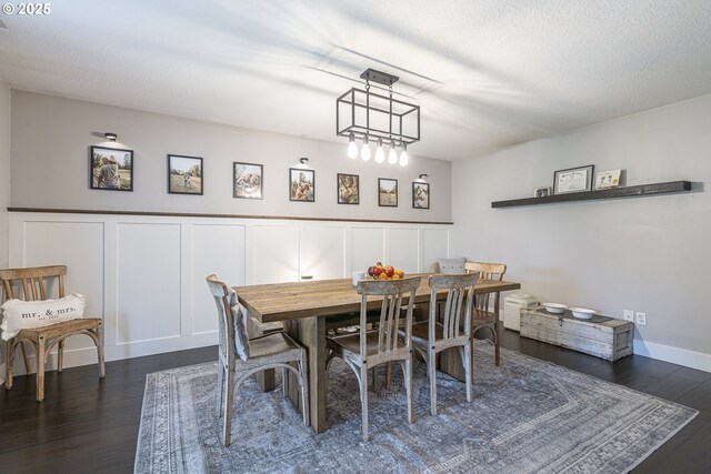 1366 Cramner St, Lafayette, OR 97127 - dining space featuring dark wood-style floors, a wainscoted wall, and a decorative wall