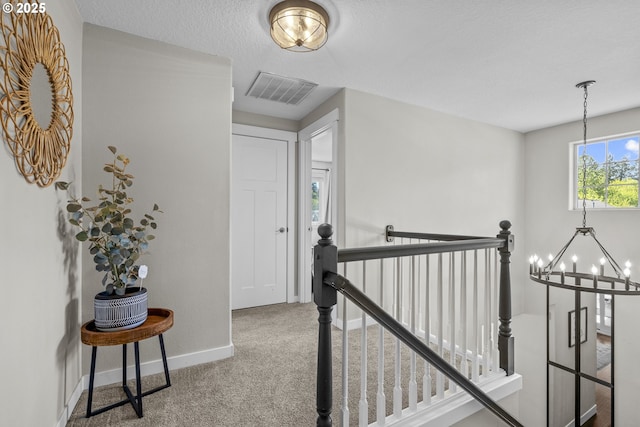 1366 Cramner St, Lafayette, OR 97127 - hallway featuring an upstairs landing, a chandelier, carpet flooring, and baseboards