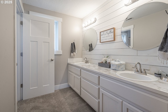 1366 Cramner St, Lafayette, OR 97127 - bathroom with double vanity, wooden walls, and a textured ceiling