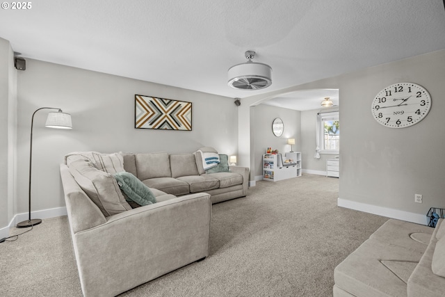 1366 Cramner St, Lafayette, OR 97127 - carpeted living area featuring arched walkways, a textured ceiling, and baseboards