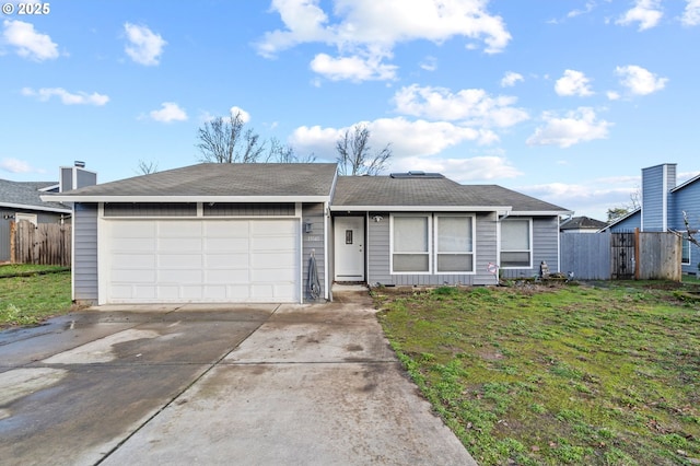 ranch-style house with a front yard and a garage