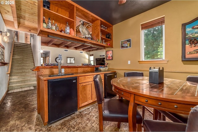 21626 Glaze Rd, Veneta, OR 97487 - bar with dishwasher, fridge, a sink, wet bar, and stairway