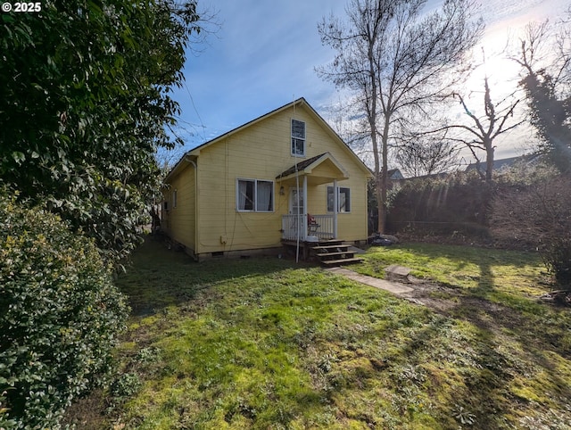 view of front of home with a front yard and crawl space