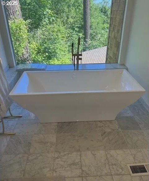 bathroom featuring a bath