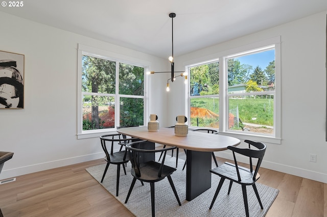 kitchen featuring a sink, a center island, stainless steel appliances, decorative backsplash, and under cabinet range hood