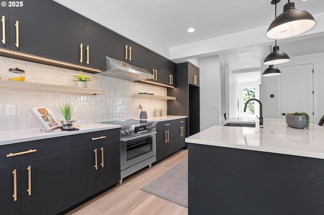 living area featuring an inviting chandelier, stairs, baseboards, light wood-type flooring, and recessed lighting