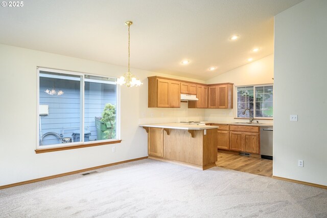1301 E Sunset Dr, Newberg, OR 97132 - kitchen with light carpet, a sink, dishwasher, a chandelier, and a kitchen breakfast bar