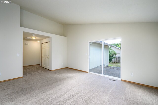 1301 E Sunset Dr, Newberg, OR 97132 - carpeted spare room with baseboards and vaulted ceiling