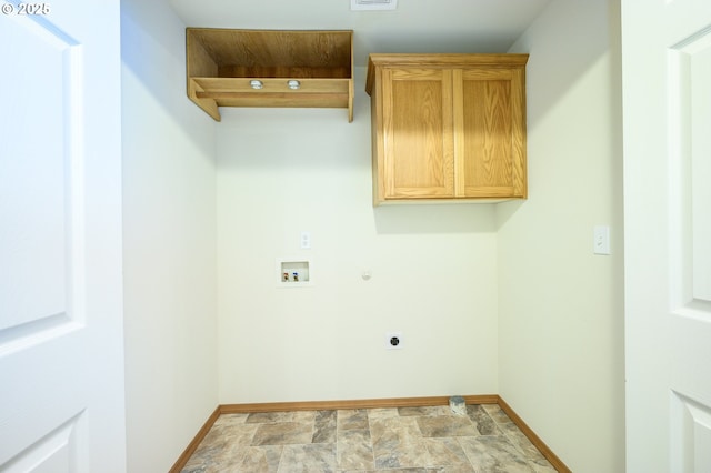 1301 E Sunset Dr, Newberg, OR 97132 - laundry room with cabinet space, electric dryer hookup, hookup for a washing machine, baseboards, and stone finish flooring