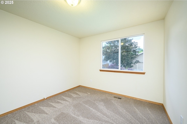 1301 E Sunset Dr, Newberg, OR 97132 - carpeted empty room featuring baseboards