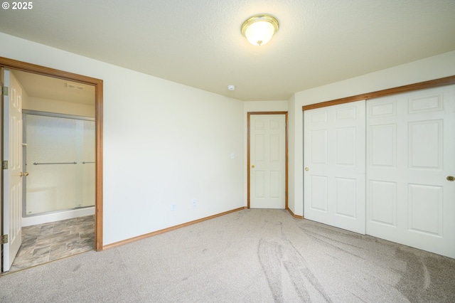1301 E Sunset Dr, Newberg, OR 97132 - unfurnished bedroom with carpet, a closet, baseboards, and ensuite bathroom