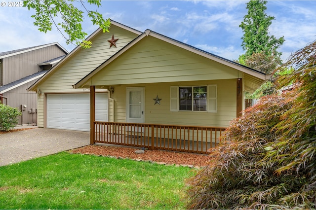 1301 E Sunset Dr, Newberg, OR 97132 - view of front of property featuring covered porch, driveway, and an attached garage
