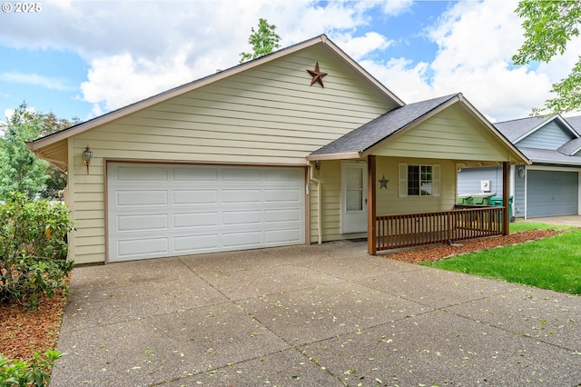 1301 E Sunset Dr, Newberg, OR 97132 - view of front facade with a porch, a garage, concrete driveway, and a shingled roof